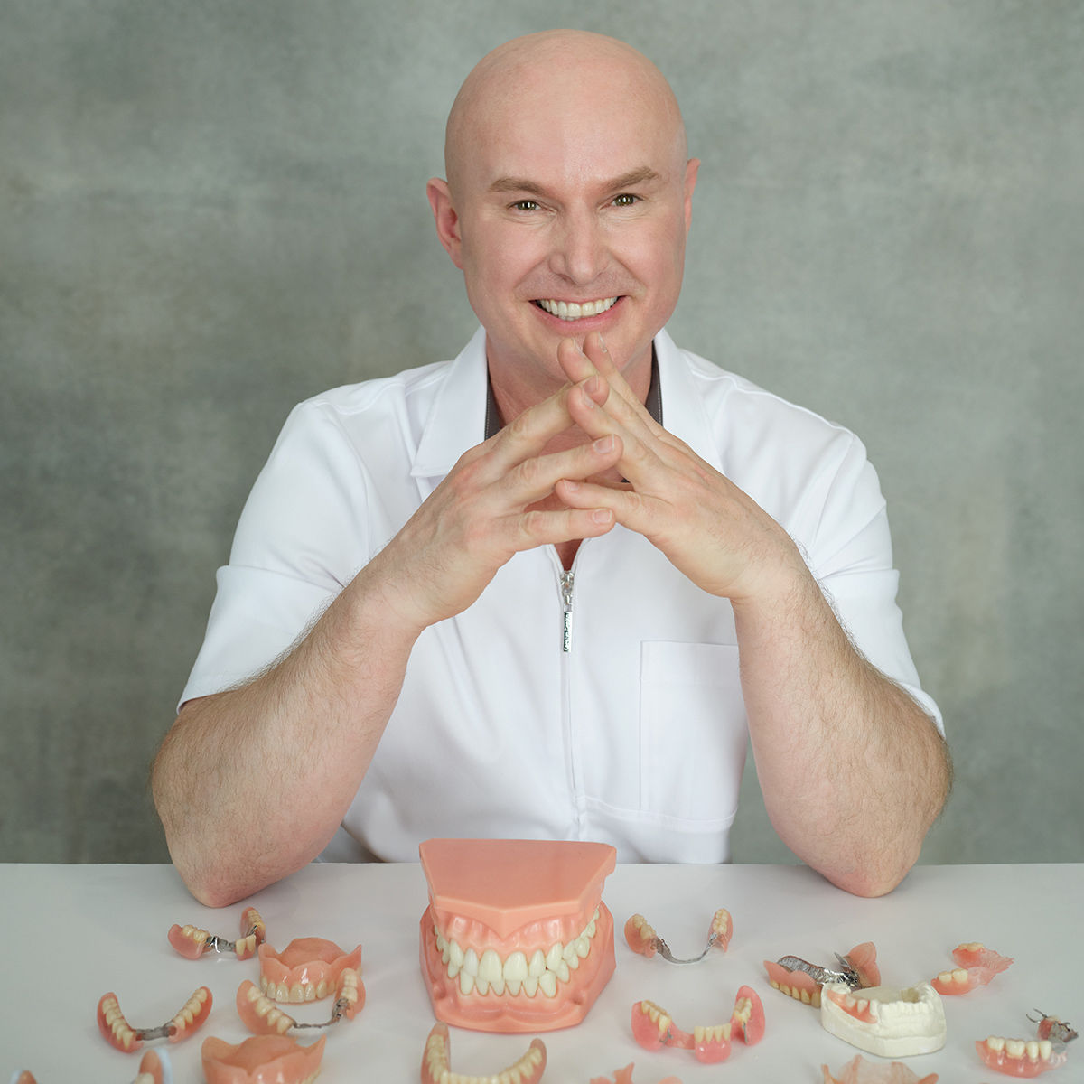 Michael Battell with dentures on a desk